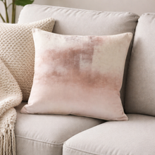 Load image into Gallery viewer, Pink and beige gradient pillow on a light gray sofa with a neutral background