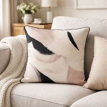 Load image into Gallery viewer, Decorative pillow with abstract design on a sofa in a living room setting