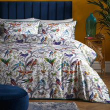 Load image into Gallery viewer, Colorful bird-patterned bedding set on a bed with a blue headboard and decorative elements.