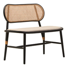 Load image into Gallery viewer, Wicker chair with black frame and beige cushion on a white background