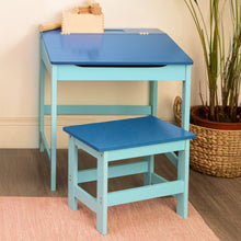Load image into Gallery viewer, Blue children's desk and chair set with wooden blocks on a beige wall background.