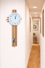 Load image into Gallery viewer, Wall clock with wooden pendulum in a hallway