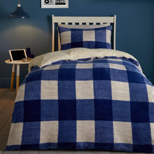 Load image into Gallery viewer, Bed with blue and white checkered duvet in a bedroom setting.