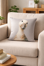 Load image into Gallery viewer, Decorative pillow with a duck design on a beige sofa in a living room setting.