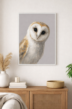 Load image into Gallery viewer, Framed picture of an owl on a wall above a wooden cabinet with decorative items.