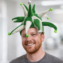 Load image into Gallery viewer, Man wearing a green and white.spikey hat with a blurred background