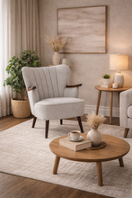 Load image into Gallery viewer, Cozy living room with a gray armchair, wooden coffee table, and decorative elements.