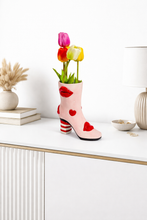 Load image into Gallery viewer, Pink high-heeled shoe planter with tulips on a white surface