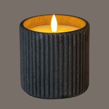 Load image into Gallery viewer, Candle in a textured black container with a gray background