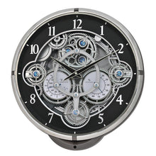Load image into Gallery viewer, A round skeleton wall clock with a black dial, silver-tone outer bezel and gear mechanism, and white Arabic numerals. The center features detailed silver cogs, hands, and small blue crystal accents, all set against a plain white background.