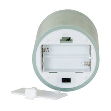 Load image into Gallery viewer, Round electronic device with a white strap on a white background