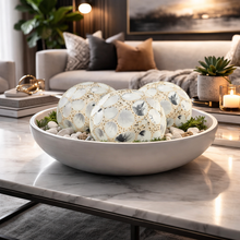 Load image into Gallery viewer, Decorative bowls with pebbles and plants on a marble table in a living room setting.