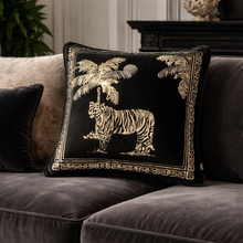 Load image into Gallery viewer, Decorative pillow with tiger and palm tree design on a gray sofa.
