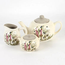 Load image into Gallery viewer, Ceramic tea set with floral design on a white background