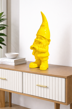 Load image into Gallery viewer, Yellow gnome figurine on a wooden side table with a white cabinet.