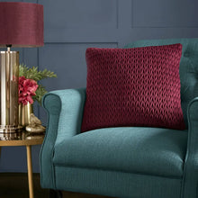 Load image into Gallery viewer, Teal armchair with a red pillow in a room with a lamp and decorative items.

