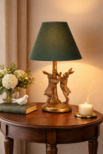 Load image into Gallery viewer, Decorative table lamp with green shade on a wooden table, surrounded by books and flowers.
