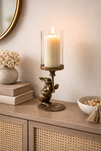 Load image into Gallery viewer, Decorative candle holder with a lit candle on a wooden surface, surrounded by books and decorative items.

