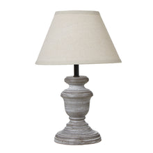 Load image into Gallery viewer, Table lamp with a textured base and beige shade on a white background
