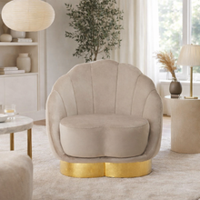 Load image into Gallery viewer, Beige armchair with gold base in a living room setting
