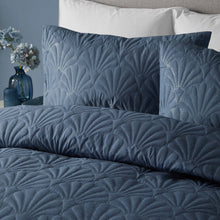 Load image into Gallery viewer, Textured blue bedding set on a bed with white pillows.
