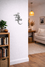 Load image into Gallery viewer, Living room with bookshelf, plant, and sofa
