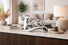 Load image into Gallery viewer, Decorative 'Peace' sign on a coffee table in a living room setting
