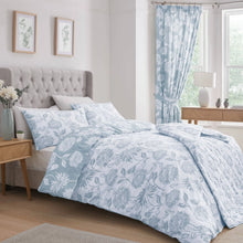 Load image into Gallery viewer, Bedroom with floral bedding, gray headboard, and light blue curtains.
