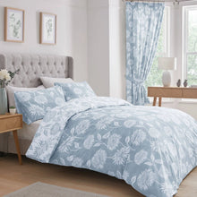 Load image into Gallery viewer, Bedroom with floral bedding and curtains, light wood furniture, and framed artwork on the wall.
