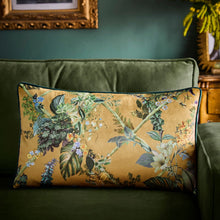 Load image into Gallery viewer, Floral-patterned pillow on a green sofa with a decorative frame in the background.
