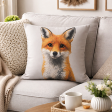 Load image into Gallery viewer, Fox-themed pillow on a couch with a cup and flowers in the foreground
