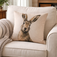 Load image into Gallery viewer, Decorative pillow with a rabbit design on a beige sofa
