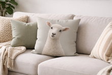 Load image into Gallery viewer, Decorative pillow with a lamb design on a beige sofa
