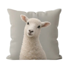 Load image into Gallery viewer, Plush toy lamb sitting on a cushion with a white background
