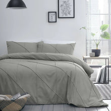 Load image into Gallery viewer, Gray bedding set on a bed in a modern bedroom with decor elements.

