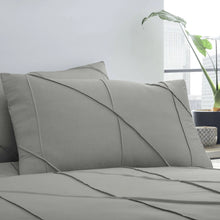 Load image into Gallery viewer, Gray bedding set with pillows on a bed in a room with a plant and window.
