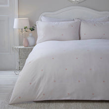 Load image into Gallery viewer, White duvet with pink heart pattern on a bed in a bedroom setting.
