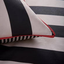 Load image into Gallery viewer, Close-up of a black, white, and red striped pillow on a matching striped background
