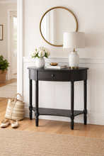 Load image into Gallery viewer, Black console table with a mirror, lamp, and decorative items in a room.
