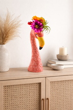 Load image into Gallery viewer, Flamingo-shaped vase with flowers on a wooden cabinet
