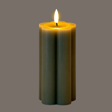 Load image into Gallery viewer, Green candle with a lit wick on a gray background
