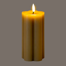 Load image into Gallery viewer, Yellow candle with a lit wick on a gray background
