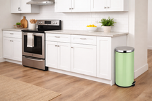 Load image into Gallery viewer, Modern kitchen with white cabinets, stainless steel appliances, and a green trash can.
