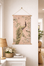 Load image into Gallery viewer, Decorative wall hanging with a peacock design in a room with a lamp and plants.
