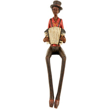 Load image into Gallery viewer, Figurine of a man playing an accordion on a white background
