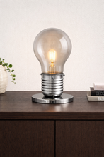 Load image into Gallery viewer, Light bulb table lamp on a wooden surface with a neutral background
