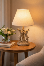 Load image into Gallery viewer, Decorative lamp on a wooden table with a soft light and neutral background
