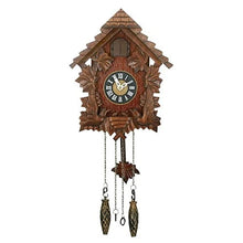 Load image into Gallery viewer, A traditional blackwood cuckoo clock with carved leaves and pinecones, featuring a rustic brown wood body, a black clock face with Roman numerals, and two hanging metal weights below.
